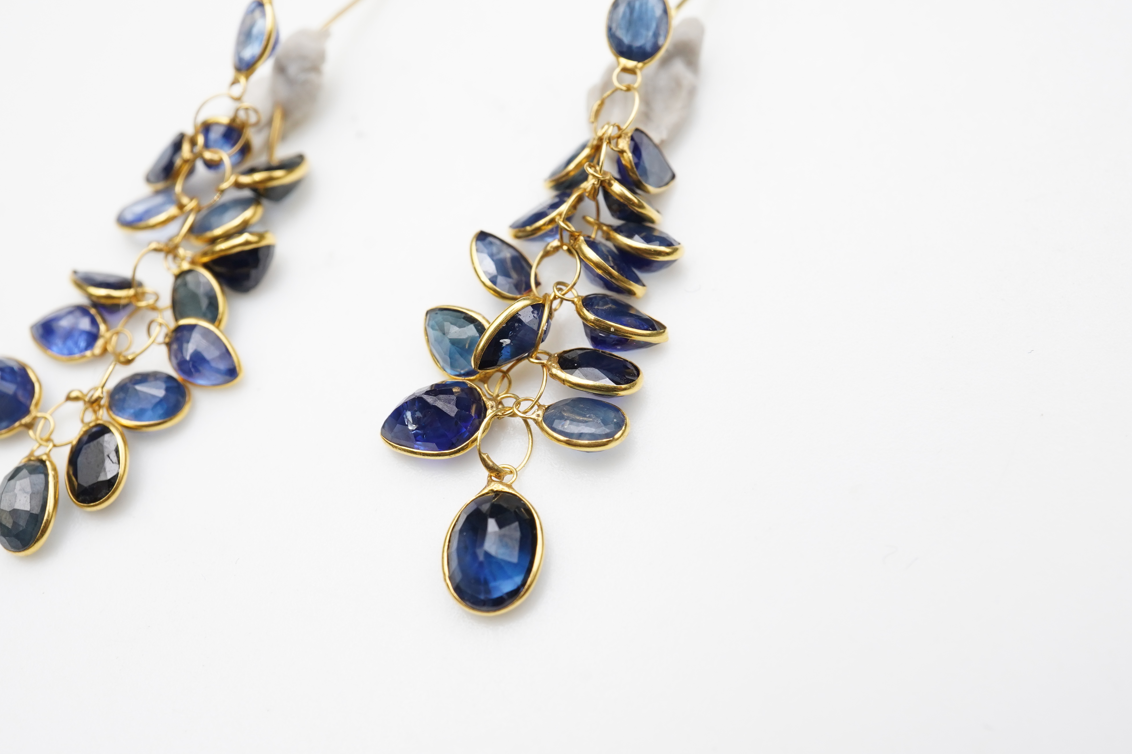 A pair of sapphire pendent earrings